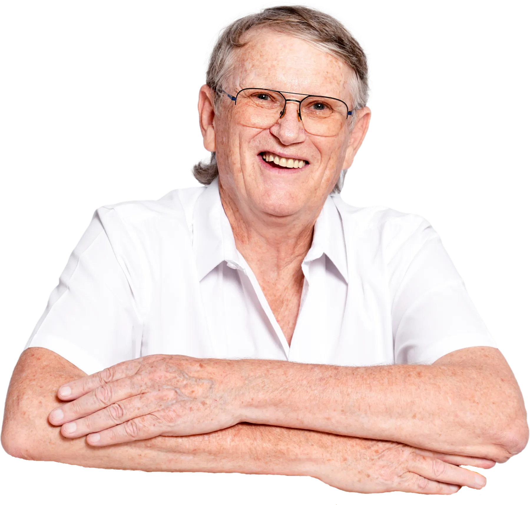 Rod Jones leaning forward, smiling warmly
